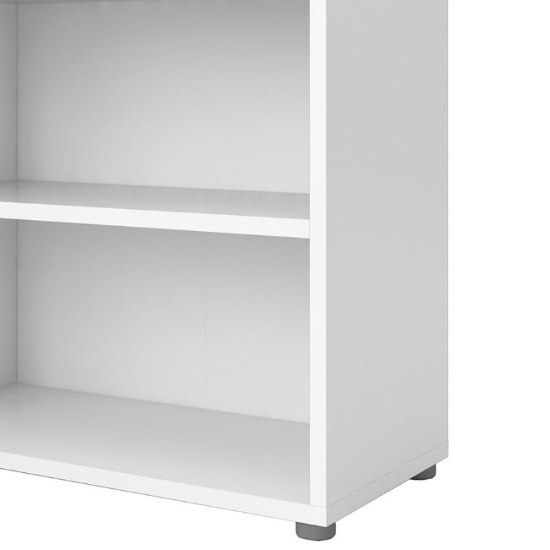 White bookshelf with two shelves on a white background