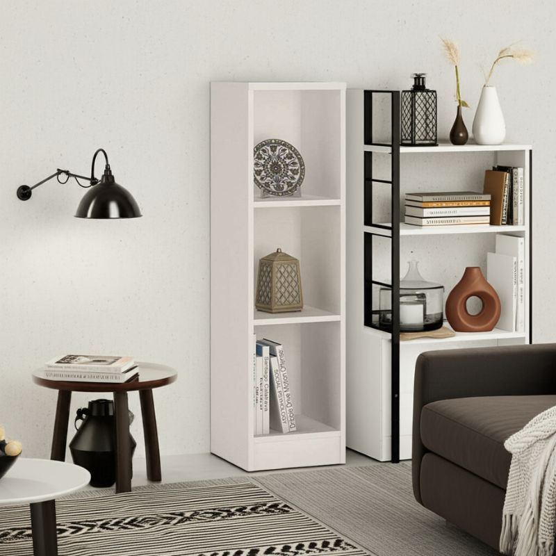Modern living room with white bookshelves, decorative items, and a brown sofa.