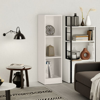 Modern living room with white bookshelves, decorative items, and a brown sofa.