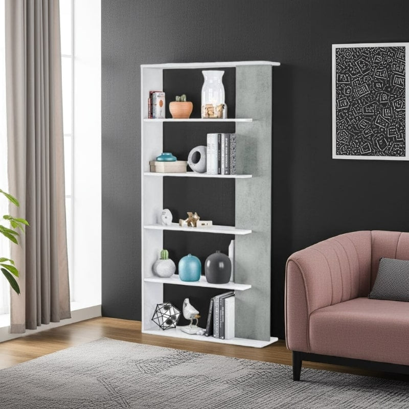 White bookshelf with decorative items in a living room setting with a pink sofa and framed artwork.