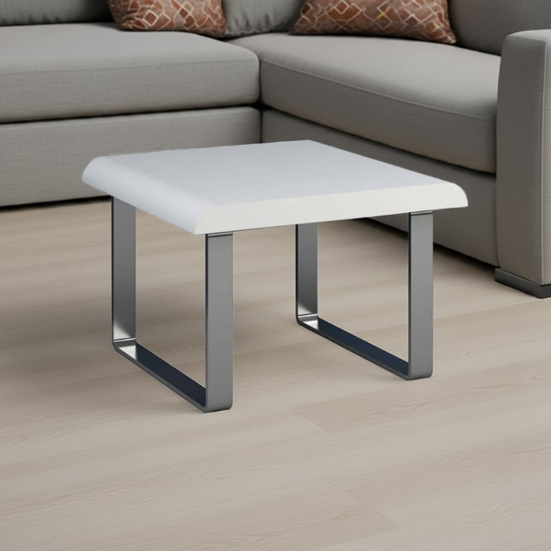 White square coffee table with metal legs in a living room setting