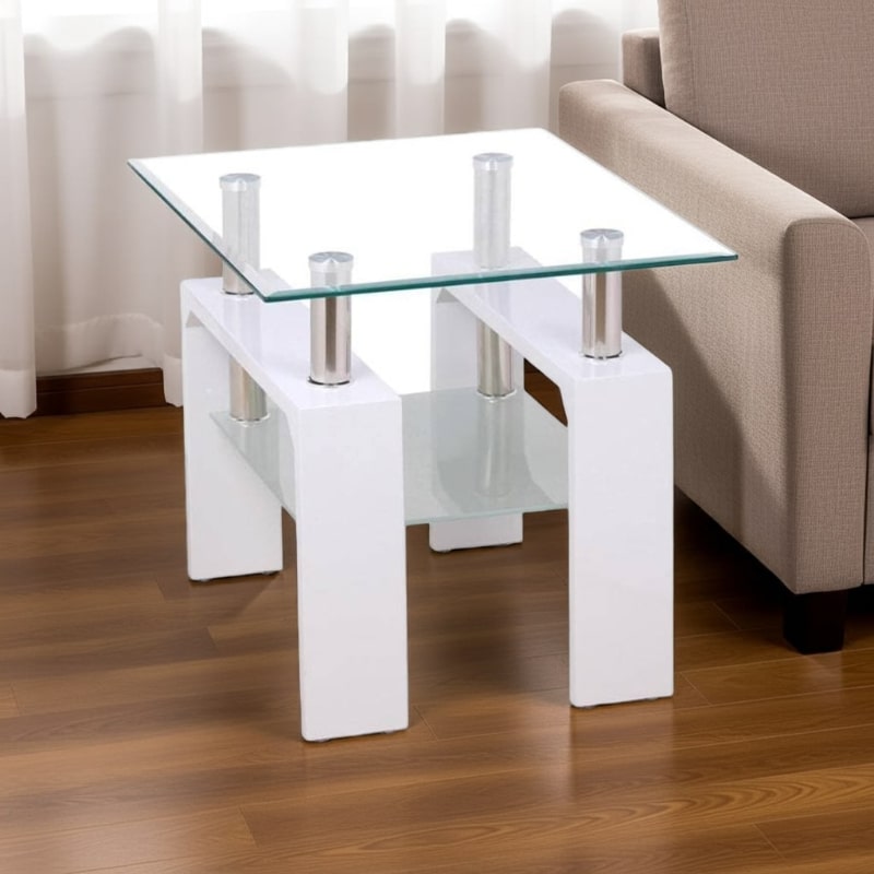 Glass coffee table with white base in a living room setting