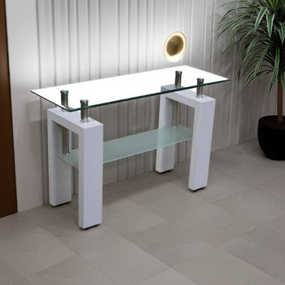 Modern glass console table with white base in a room setting.