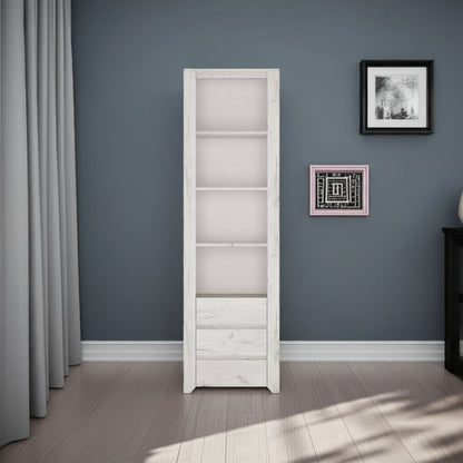 Tall white bookshelf against a gray wall with framed pictures.
