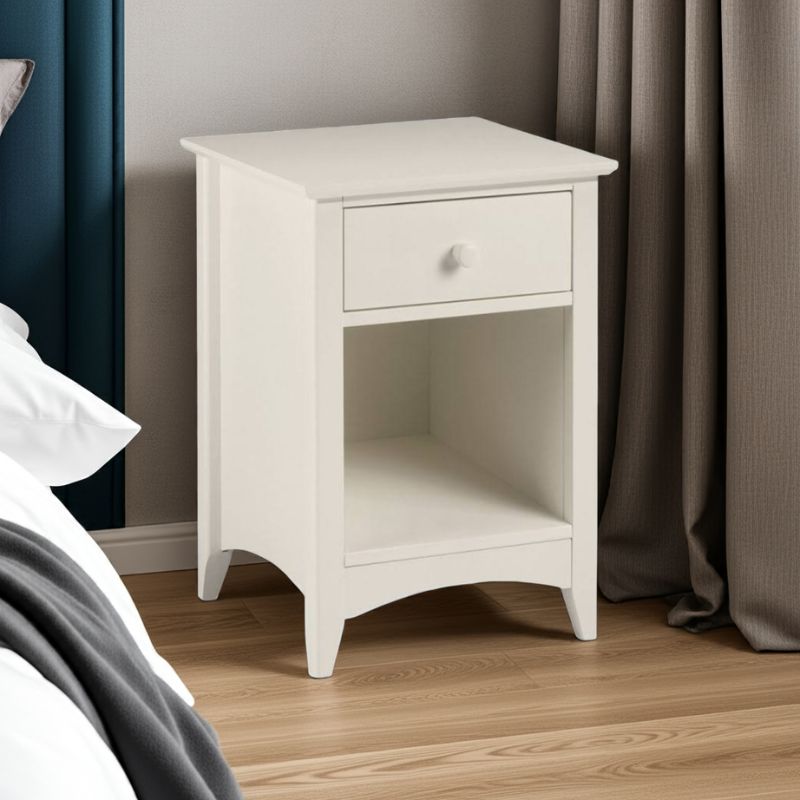 White nightstand with a drawer in a bedroom setting