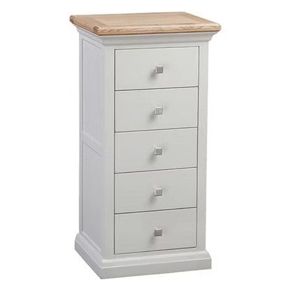 White dresser with four drawers and a wooden top on a white background