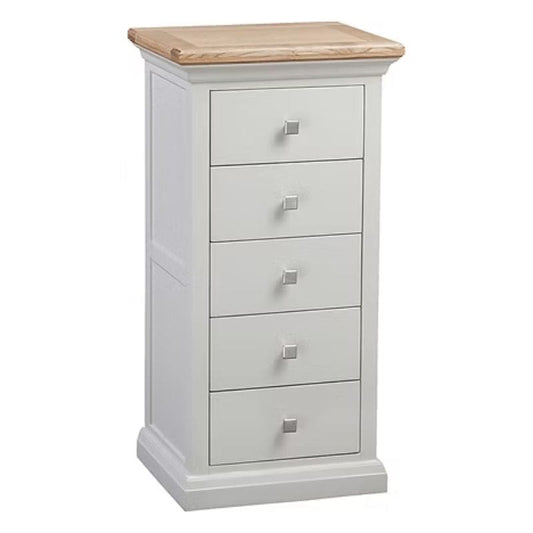 White dresser with four drawers and a wooden top on a white background