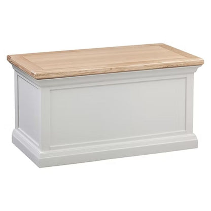 White wooden storage chest with a natural wood top on a white background