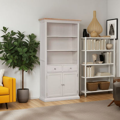 Living room with a white bookshelf, yellow sofa, and decorative items.