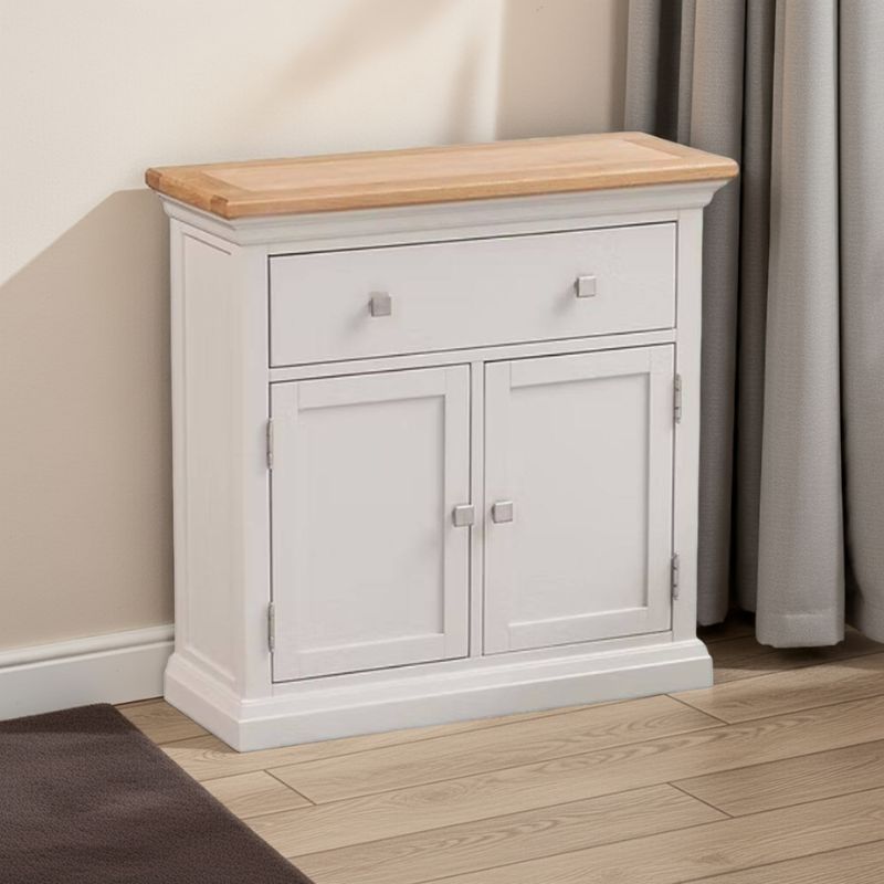 White cabinet with wooden top in a room setting