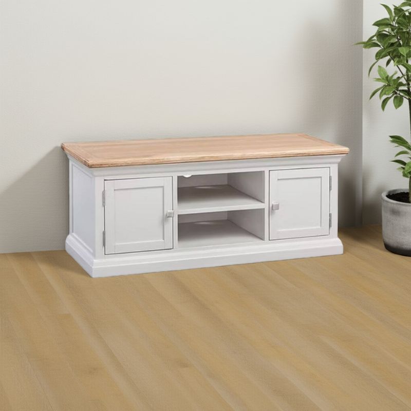 White TV stand with wooden top in a room with a plant