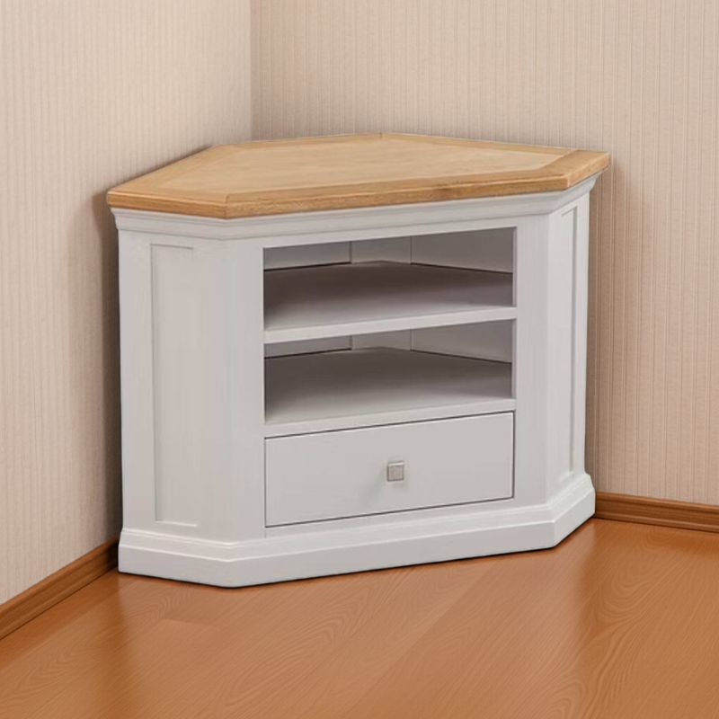 Corner TV stand with wooden top in a room with beige walls and wooden floor.