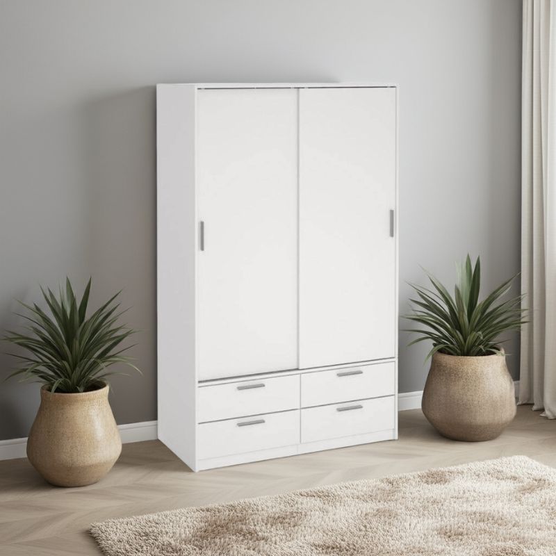 White wardrobe with drawers in a room with two potted plants.