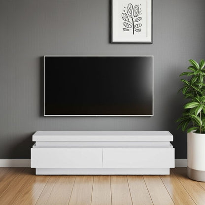 Modern living room with a flat-screen TV on a white stand against a gray wall.