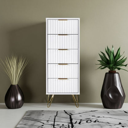 Tall white cabinet with gold legs in a room with decorative plants and a rug.