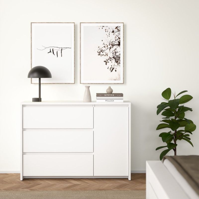 White dresser with decor items in a minimalistic room