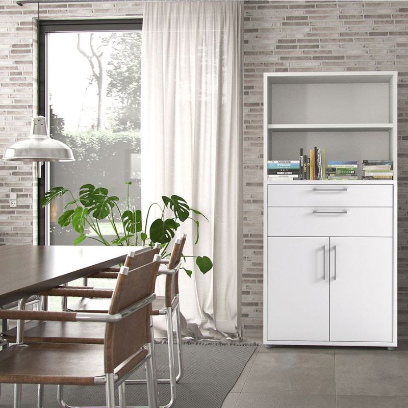 Modern dining area with a white bookcase storage cabinet, wooden table, and chairs against a brick wall.