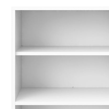 White bookshelf with three shelves on a white background