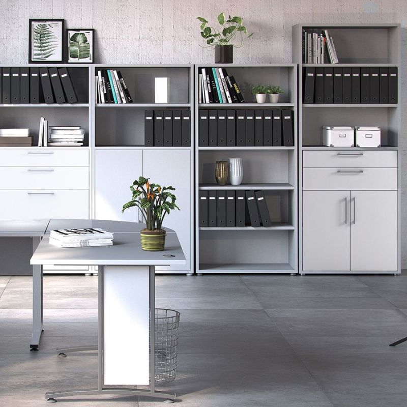 Modern office setup with a desk, bookshelves, and cabinets.