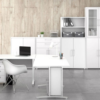 Modern office setup with white furniture, desk, chair, and white bookshelves against a wooden wall.