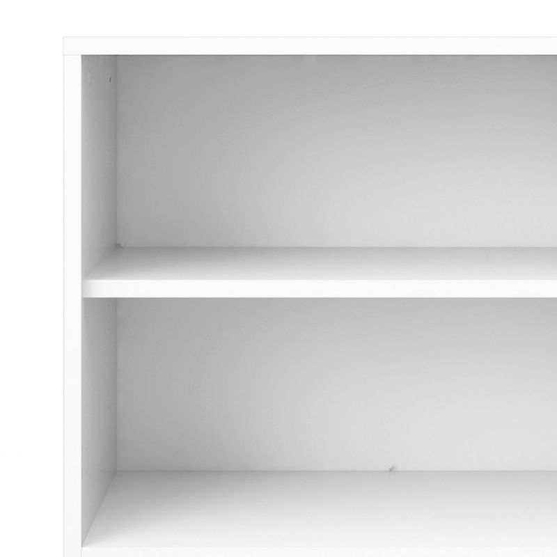 White bookshelf with two shelves on a white background