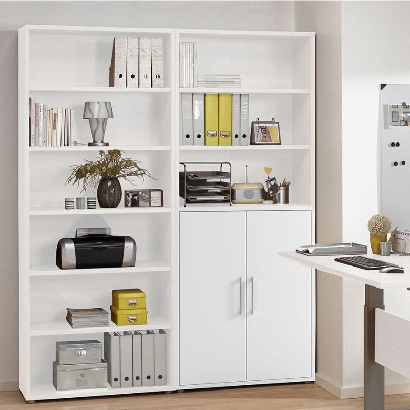 White bookshelf with various items in a room setting