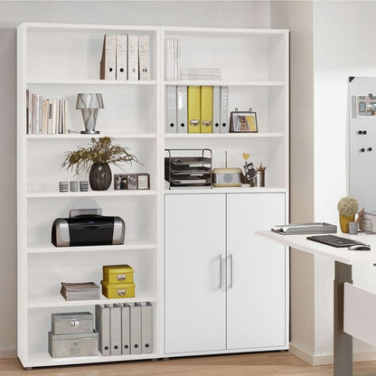 White bookshelf with various items in a room setting