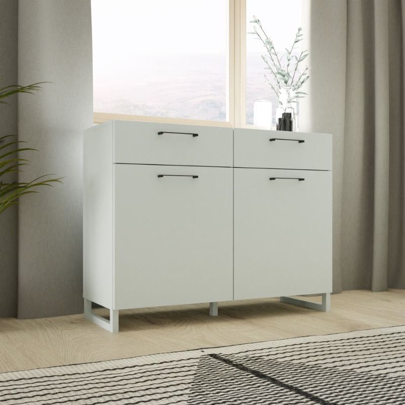 White storage cabinet with drawers in a room with a window and plant