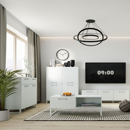 Modern living room with white furniture, a black chandelier, and a TV displaying the time.