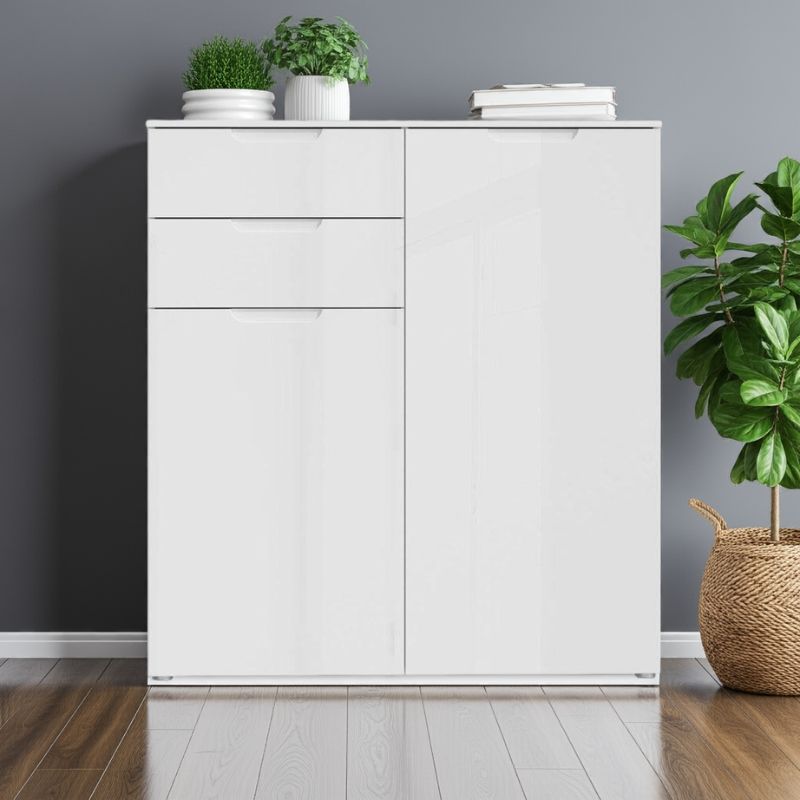 White cabinet with decorative items against a gray wall