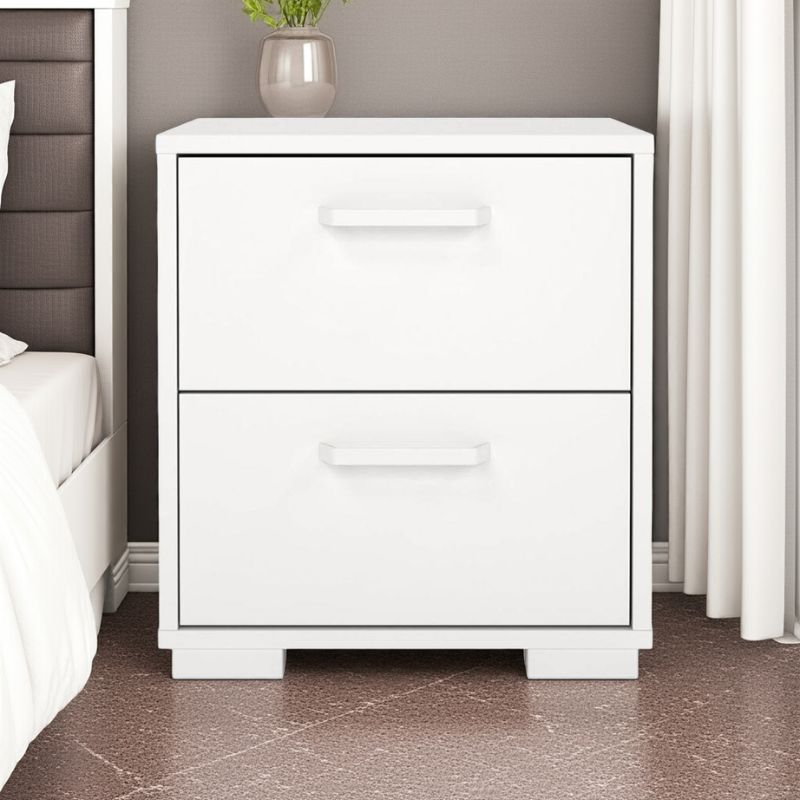 White bedside table with two drawers in a bedroom setting