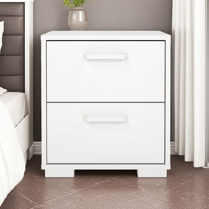 White bedside table with two drawers in a bedroom setting