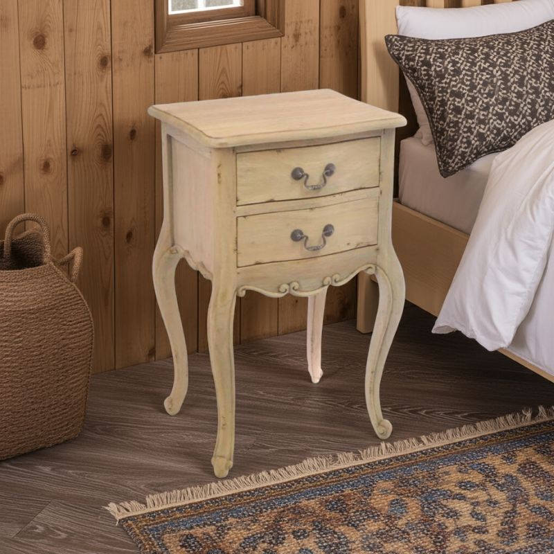 Vintage-style nightstand with two drawers in a bedroom setting.