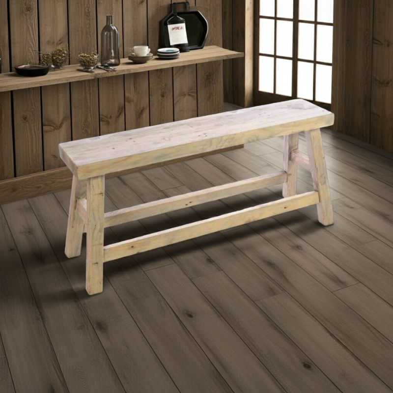 Wooden bench in a room with wooden walls and floor