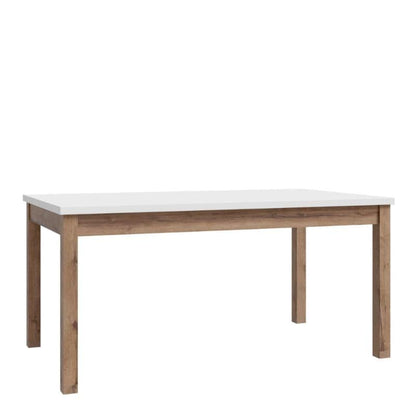 Extending dining Table with white top and wooden legs on a white background