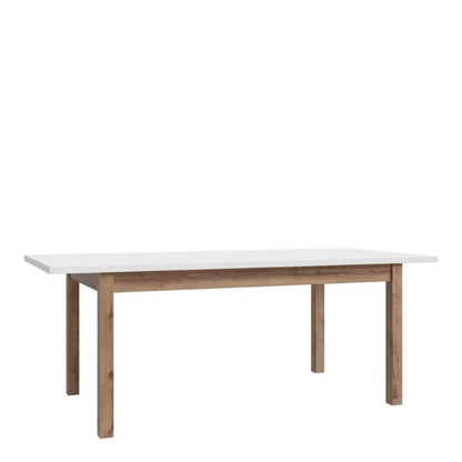 Extending Dining Table with white top and wooden legs on a white background