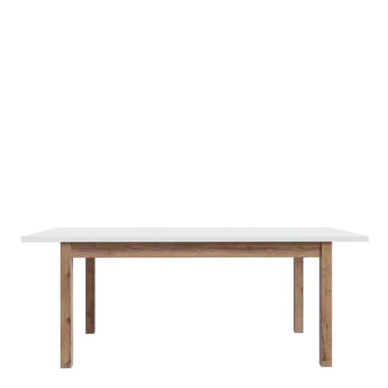 Extending White dining table with wooden legs on a white background