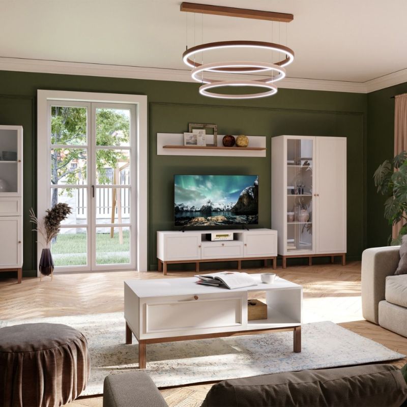 Modern living room with white furniture, TV, and decor