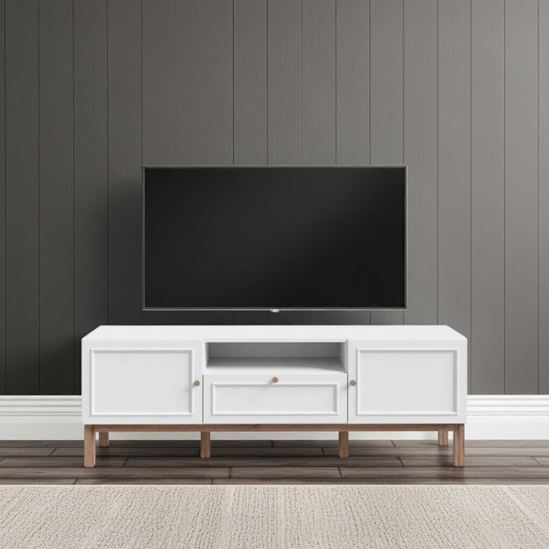 White TV stand with a black TV mounted on a gray paneled wall.