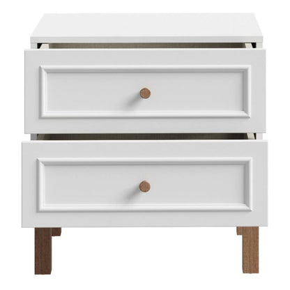 White nightstand with two drawers and wooden knobs on a white background