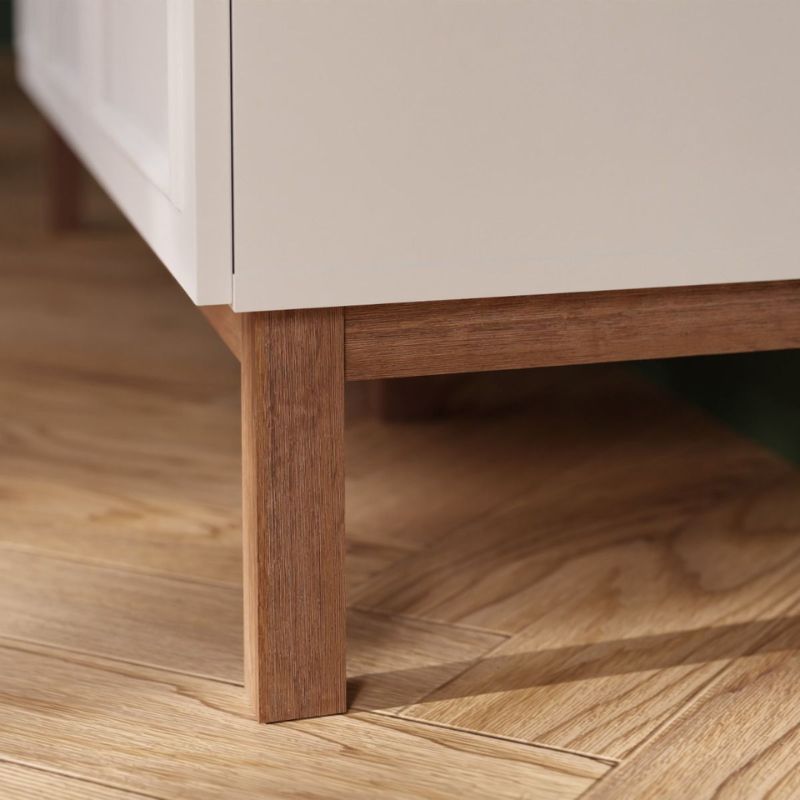Close-up of a wooden leg on a piece of furniture with a blurred background