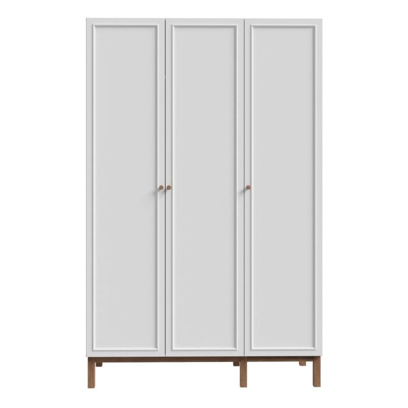 White three-door wardrobe with wooden legs on a white background