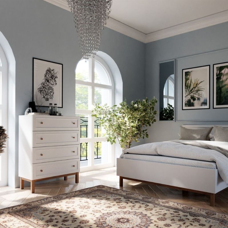 Modern bedroom with white furniture, gray walls, and decorative elements.