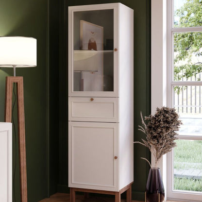 White narrow display cabinet with a single drawer and two doors on a white background