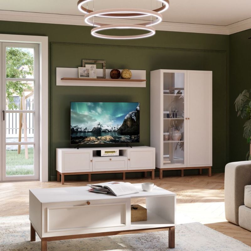 Modern living room with white furniture, TV, and decor.