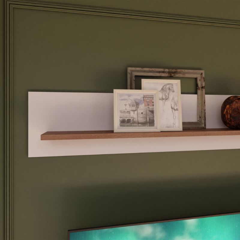 Wooden shelf with decorative items against a green wall