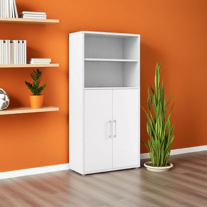 White bookcase with cupboard with shelves against an orange wall with plants and books.