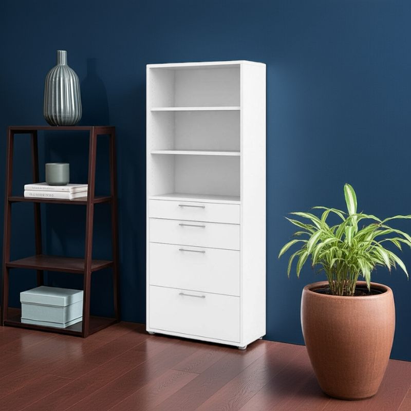White bookcase with drawers next to a wooden shelf and potted plant against a blue wall.