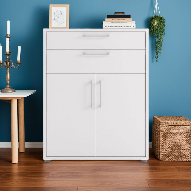 White cabinet with two doors and two drawers against a blue wall with decorative items.