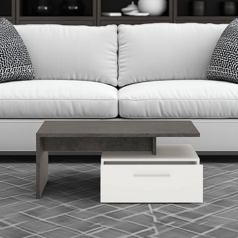 White sofa with a black and white coffee table on a tiled floor